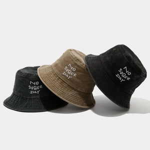 Three washed cotton bucket hats with 'NO SOBER DAY' embroidery in black, khaki and grey