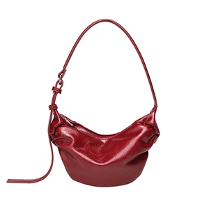 Large dark red pleated crescent bag in oily soft leather with adjustable strap