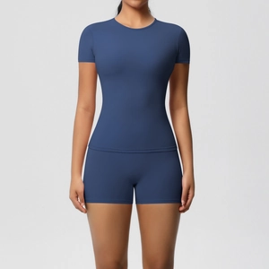 Detailed close-up of dark blue high-stretch fitness yoga set with short sleeves and shorts