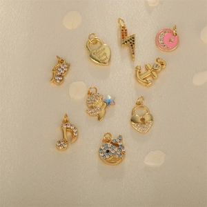 Gold-plated charms set with zircon, featuring butterfly, heart, and star-moon designs