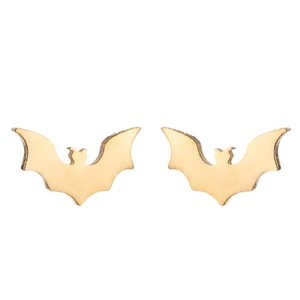 Macro detail of golden bat-shaped stainless steel stud earrings on white background