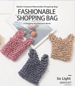 Detailed view of elastic pleated tote bags in pink, blue, and khaki textured fabric