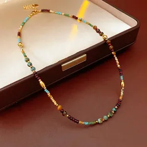 Bohemian multicolored beaded necklace with gold titanium steel accents in a leather box