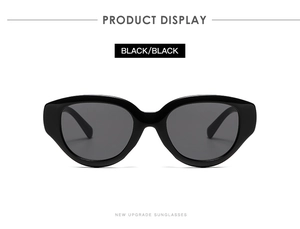 Close-up of stylish black cat-eye sunglasses with premium glossy finish and dark lenses