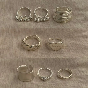 8-piece set of silver vintage adjustable rings featuring heart and woven designs