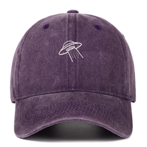 Detailed embroidery of a white UFO on a washed purple vintage cotton baseball cap