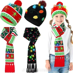 Detail of Christmas knitted hat and scarf set with colorful LED lights and pom-poms