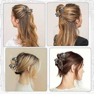 Detail view of retro silver metal rose hair claw showing intricate floral design on hair