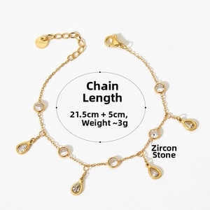 Close-up of golden stainless steel anklet with cubic zirconia drops and size label
