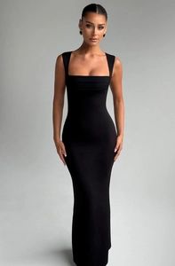 Detail of elegant square neck black slim fit maxi dress showing high-quality fabric texture