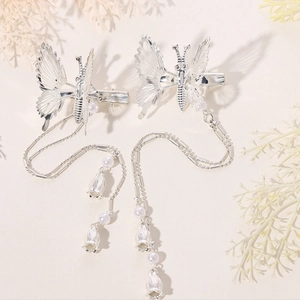 Elegant silver butterfly hair clips with long pearl tassels and lily of the valley charms