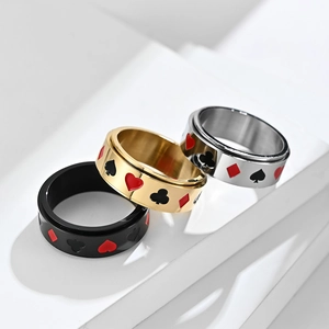 Set of three rotating poker motif rings in gold, silver, and black finish stainless steel