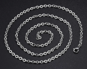 Macro view of polished silver steel O-chain necklace featuring a secure lobster clasp