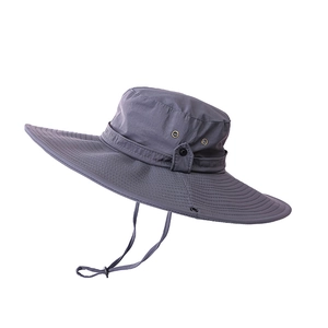 Detail of dark grey wide brim sun hat showing adjustable windproof strap and vent