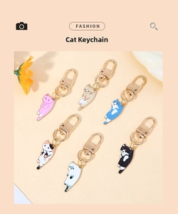 Detailed group view of six colorful cartoon alloy cat keychains with metal clasps