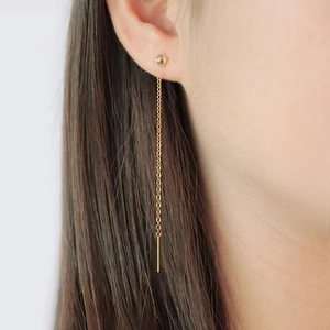 Minimalist 18K gold plated titanium steel bead tassel threader earrings worn by a model