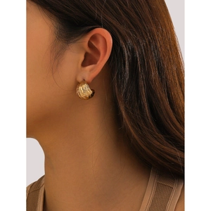 18k gold plated chunky C-shaped hoop earrings with textured metal finish on a model