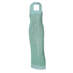 Detailed close-up of mint green sequin dress showing halter neck and tulle stitching