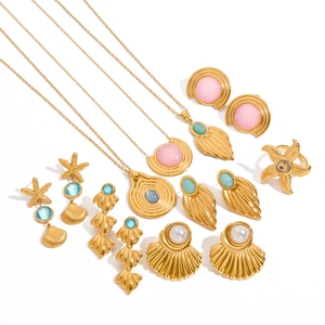 Gold ocean theme jewelry set with shell and starfish charms in assorted gem colors