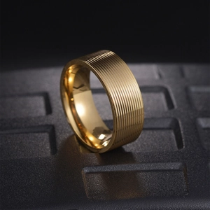 8mm gold-plated titanium steel ring with fine grooved texture shown at 45-degree angle