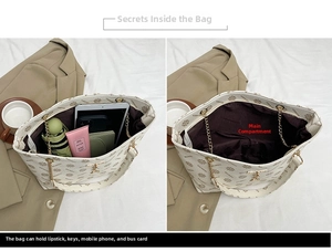 Interior storage capacity of cream tote bag holding iPad, umbrella and wallet