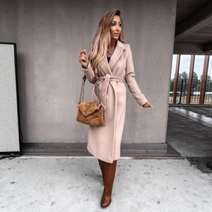 Elegant beige long wool coat with a waist belt and large lapels for fall fashion