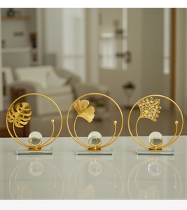 Detail of luxury gold metal leaf art ornaments with crystal balls and glass bases