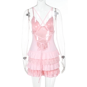 Detail of pink jumpsuit featuring open back with cross-tie laces and layered ruffles