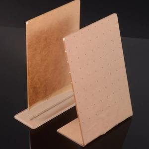Detailed view of acrylic earring display stand with protective film and pre-drilled holes