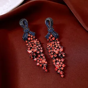 Boucles d'oreilles vintage avec nœud en zircon bleu et cristaux marquise rouge foncé