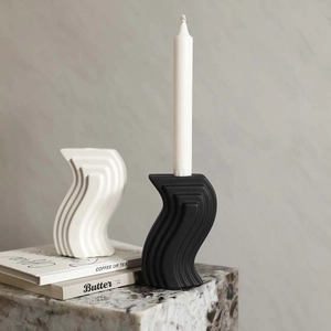 Modern S-shaped ceramic candle holder set in black and white minimalist wave design