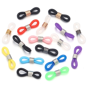 Close-up of anti-slip silicone eyewear connectors in multiple colors with metal coils