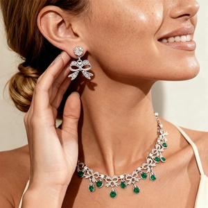 Exquisite bow jewelry set with shimmering green waterdrop pendants for elegant women
