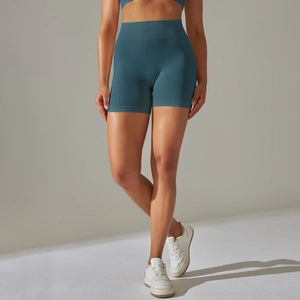 Detail showing seamless duck blue high-waisted yoga shorts with ribbed texture fabric