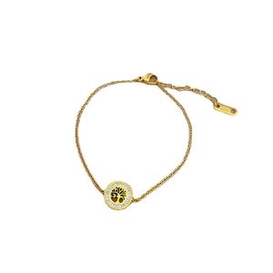 Golden titanium steel bracelet featuring a Tree of Life pendant with white zircon stones