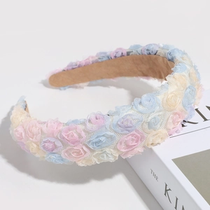 Detailed shot of pastel lace 3D flowers on a headband with anti-slip velvet lining