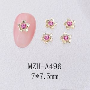 Detailed close-up of 7.5mm alloy five-petal flower nail charms with pink zircons