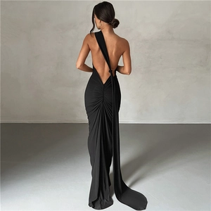 Close-up detail of the elegant open-back design and draped fabric on this black evening dress