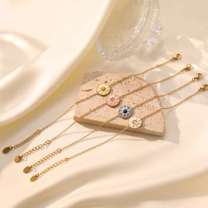 Elegant gold eight-pointed star compass bracelets with colorful enamel sunburst charms