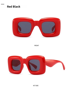 Front and side view of chunky red polygon sunglasses with dark grey lenses