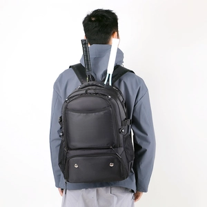 Rear view of black athletic backpack featuring specialized racket storage compartment
