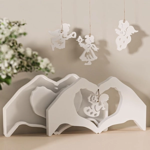Detail of DIY heart gesture base and angel ornaments made from ivory silicone molds
