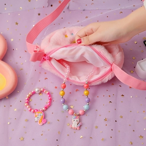Pink plush unicorn crossbody bag set with matching beaded necklace and bracelet for girls