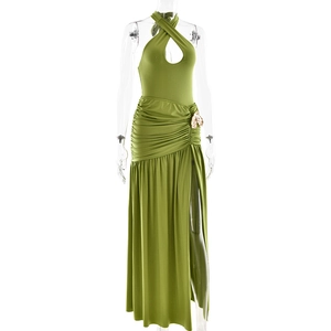 Detail of green halter neck maxi dress with waist pleats, side slit, and gold buckle