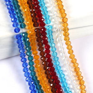 Macro shot of multi-color faceted crystal wheel beads in various vibrant jewel tones