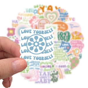 Detail of waterproof Danish pink sticker featuring blue Love Yourself text and design