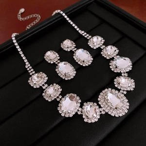 Elegant 2-piece jewelry set featuring sparkling oval crystal necklace and stud earrings