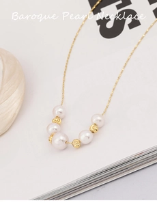 Detailed shot of S925 silver baroque pearl necklace on a minimalist book background