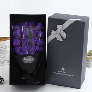 Detail of 18 purple soap roses in a black gift box with elegant decorative ribbons