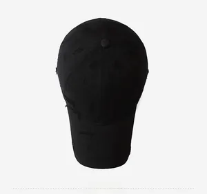 Top-down macro view of a vintage black baseball cap with unique distressed and torn details